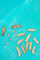 Dried peanuts in closeup,Peanuts in shells on wood background,