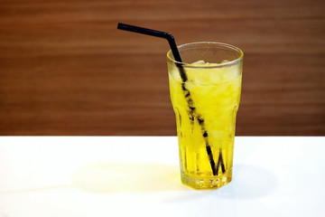 Ice Chrysanthemum tea on white table and wood background