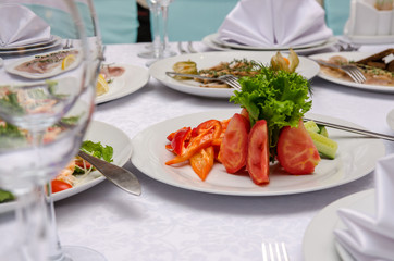 Served restaurant table. Salad with vegetable in restaurant