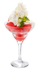 Balls of watermelon in a glass Cremant with whipped cream. Isolated on white.