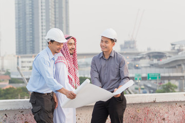 Harmonious Muslim engineer and technician team meeting in building construction site. Teamwork collaboration relation concept