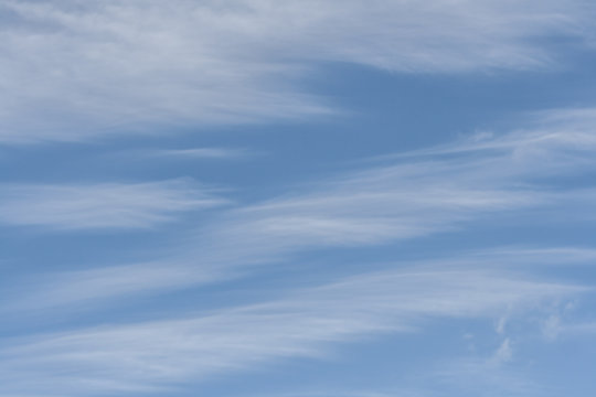 Blue skies with white cirrus clouds