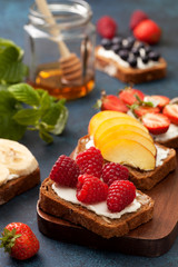Toasts with cream cheese and fresh berries