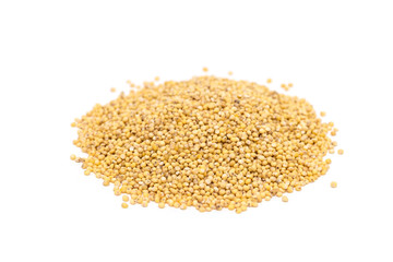 Heap of organic millet groats, sideview, isolated