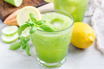 Healthy lemonade with cucumber, basil, lemon, honey and sparkling water, horizontal