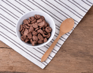 Chocolate cereal in white bowl for breakfast