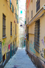 Old beautiful empty narrow streets in small city of Genova in Italy