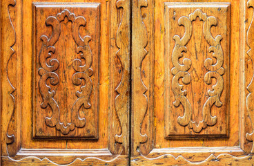 detail of an antique wooden door with inlay