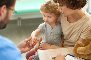 Cute Little Child Visiting Doctor