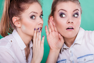 Two teenagers shares secrets, gossip
