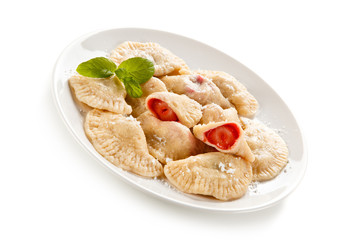 Dumplings - stuffed noodles on white background