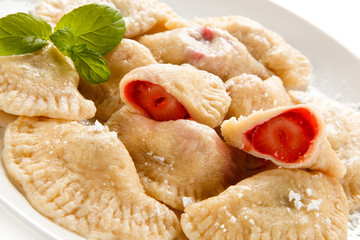 Dumplings - stuffed noodles on white background