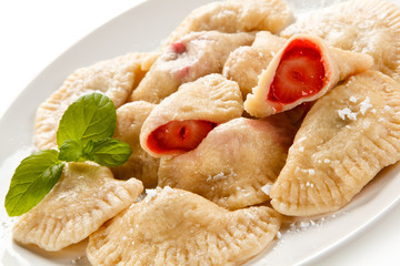 Dumplings - stuffed noodles on white background