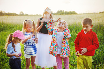 A group of children play by the spinners