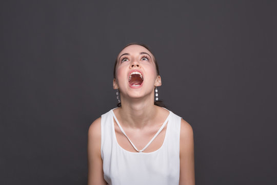 Screaming Young Woman Looking Up