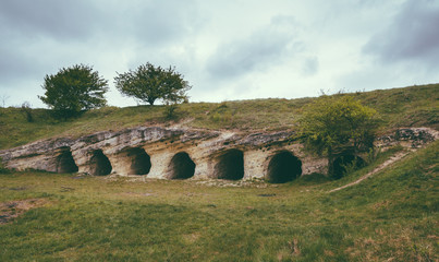 Fototapeta na wymiar Ancient handmade caves near settlement of the White Croatian - Stilsko, Ukraine. Stilsko was one of the biggest cities of Europe in 9 century.