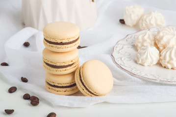 Obraz na płótnie Canvas Coffee macarons with chocolate. French delicate dessert for Breakfast