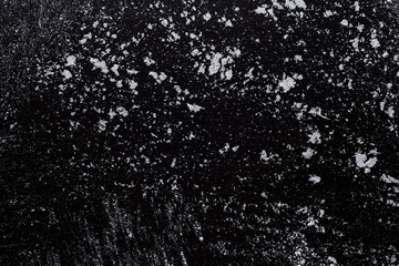 Baking concept on black background, sprinkled flour with copy space