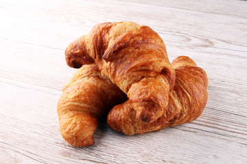 freshly baked croissants on white board, bakery concept