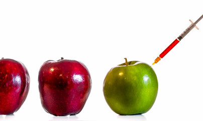 Apples with syringe