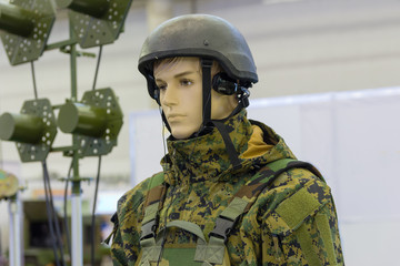 Dummy in army helmet with headphones. Armament