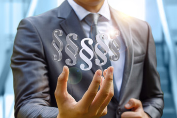 Businessman hand shows the paragraphs article.