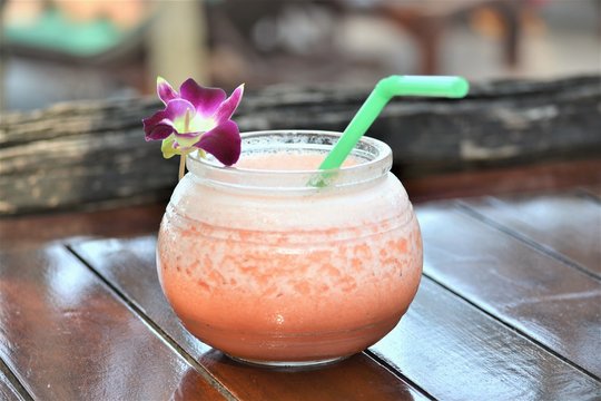 Mango Juice with a orchid decoration