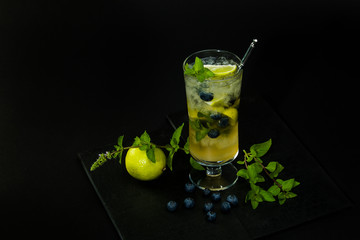 Blueberry mojito on the black background