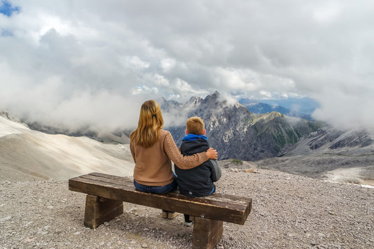 mother and her son enjoying the panorama of the alps