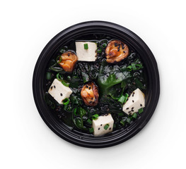 Japanese cuisine. Miso soup with tofu cheese, mushrooms and seewed