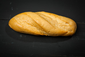 Baguette on a black background