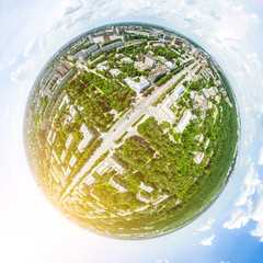 Aerial city view with crossroads and roads, houses, buildings, parks and parking lots, bridges. Helicopter drone shot. Wide Panoramic image.
