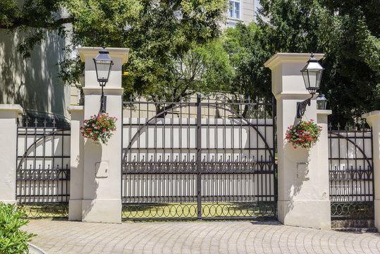 Beautiful forged gates with stone columns.
