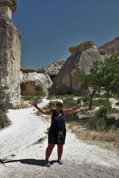 An English lady visiting the famous Fairy Chimneys in Cappadocia, Goreme, 2017