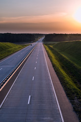 Country highway and sunset. Clear road great nature around
