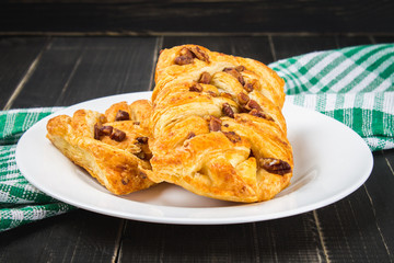 Danish pastry maple pecan with nuts and maple syrup