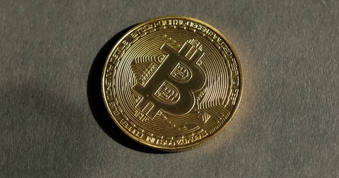Crypto currency Gold Bitcoin - BTC - Bit Coin. Macro shots crypto currency Bitcoin coins rotating.
