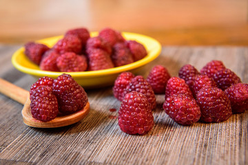 Fresh berries raspberry forest fruit on a wooden table 