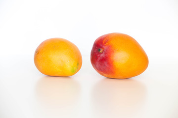 Fresh ripe mango,  shown on a light background