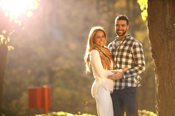 Portrait of a happy young couple enjoying a day in the park together