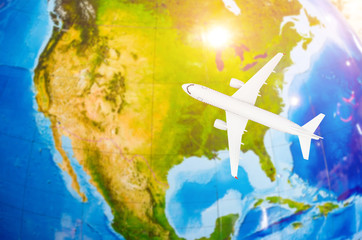 Fototapeta na wymiar Flight to North America symbolic image of travel by plane map