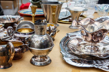 Old vintage kitchen utensils, glasses, plates, boilers, souvenirs, shots from the flea market