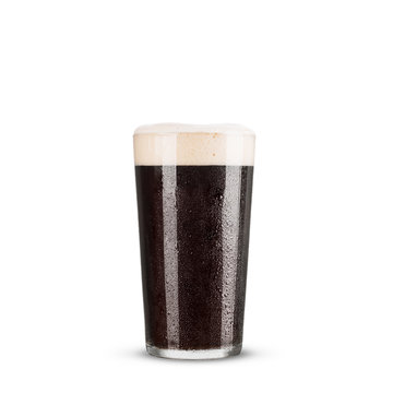 Dark beer in a glass on a white background