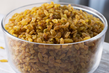 raisins in a glass bowl. Fresh organic raisins