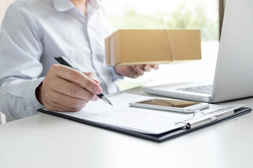 Man seller write a order product to prepare for delivery to customers, customer service network connection market, technology on global, Order online for customer convenience