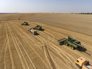 Combines in the plowing up to the wheat