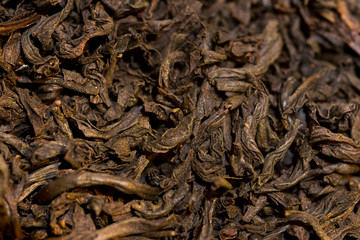 Macro shot of dried tea leaves as a background