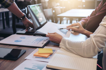 Startup business people group meeting, Young creative coworkers team working and discussing new plan project in office, entrepreneurs, brainstorming, Teamwork, analyze plans, professional investor