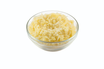 Grated Parmesan Cheese into a glass bowl. Top view photo
