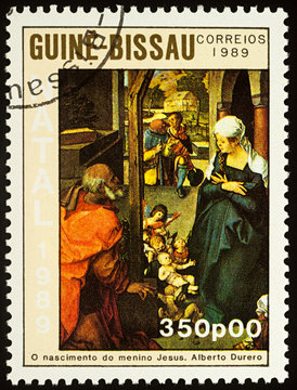 Painting The birth of the baby Jesus by Albrecht Durer on postage stamp